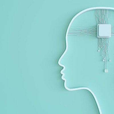 Modell eines Kopfes mit Schalter im Gehirn, an den zahlreiche Kabel zusammenlaufen