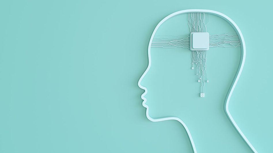 Modell eines Kopfes mit Schalter im Gehirn, an den zahlreiche Kabel zusammenlaufen