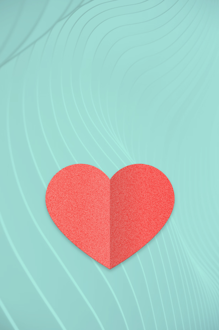 Icon eines roten Herzes auf blauem Hintergrund – Symbolbild zu Informationen zu medikamentösen Krebstherapien.